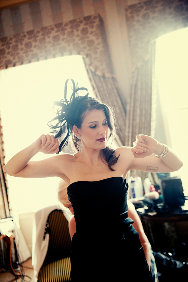 bridesmaid in black strapless dress getting ready - photo by Houston based wedding photographer Adam Nyholt